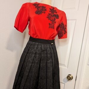 Elegant Red Top with Black Lace Accents